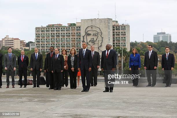 President Barack Obama attends a wreath-laying ceremony at Jose Marti monument in the Revolution Palace of Havana next to the Vice-President of the...