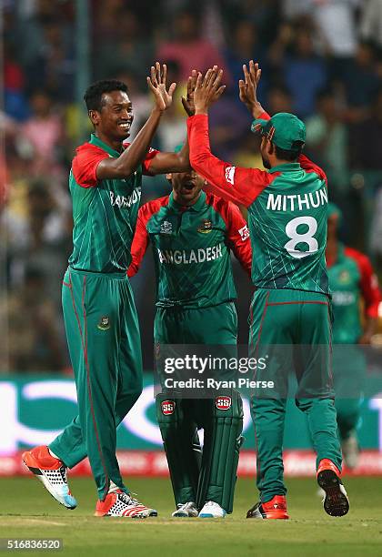 Al-Amin Hossain of Bangladesh celebrates after taking the wicket of Usman Khawaja of Australia during the ICC World Twenty20 India 2016 Super 10s...