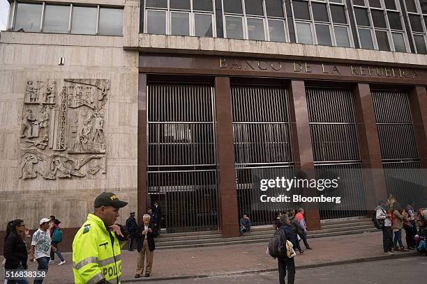 Police officer walks outside Banco de la Republica, Colombia's central bank, in Bogota, Colombia, on Tuesday, March 15, 2016. Colombia's central bank...