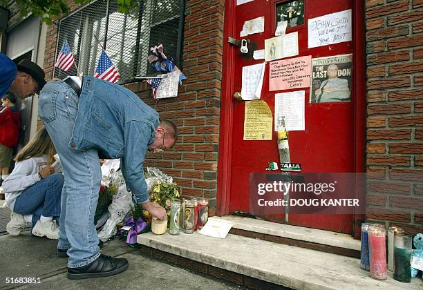 Well-wishers light candles for former mob boss John Gotti outside the Bergin Hunt and Fish Club in Queens, New York 15 June 2002. The former head of...