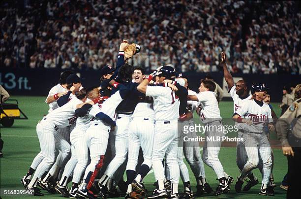 Members of the Minnesota Twins celebrate defeating the Atlanta Braves in Game 7 of the 1991 World Series on the field at Hubert. H. Humphrey...