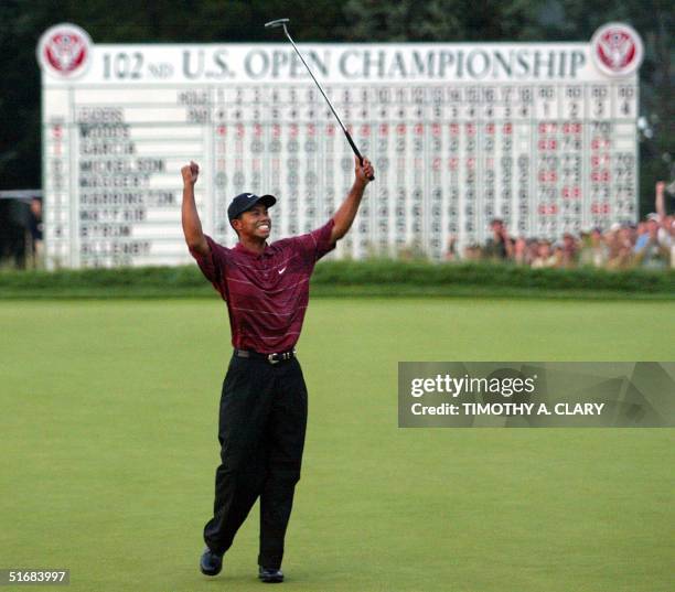 Us golfer Tiger Woods celebrates his win on the 18th green 16 June in the 2002 US Open Championship at Bethpage Black in Farmingdale, NY. AFP...