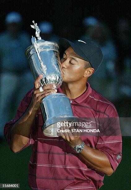 Golfer Tiger Woods kisses the trophy after winning the 102nd US Open Championship 16 June, 2002 at Bethpage State Park in Farmingdale, NY. Woods won...