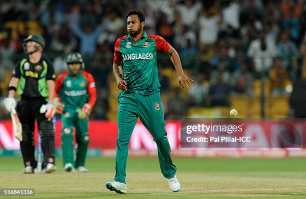 Shakib Al Hasan of Bangladesh reacts after taking a return catch to get David Warner of Australia out during the ICC World Twenty20 India 2016 match...