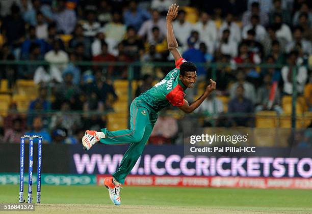 Al-Amin Hossain of Bangladesh bowls during the ICC World Twenty20 India 2016 match between Australia and Bangladesh at the Chinnaswamy stadium on...