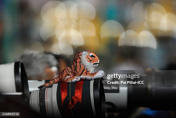 Bangalore, INDIA A Bangladesh photographer has a soft tiger toy on the top of his lens, to show his support to the team during the ICC World Twenty20...