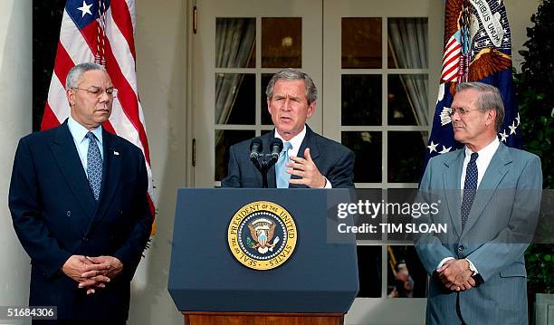 President George W. Bush joined by US Secretary of State Colin Powell and US Secretary of Defense Donald Rumsfeld delivers his peace plan for the...
