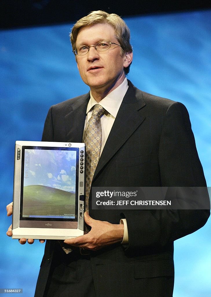 Jeff Rakees Jeff Raikes, group vice president at Microsoft, shows a new Fujitsu ...