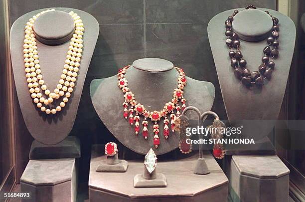 Jewelry from the estate of Jacqueline Kennedy Onassis on preview at Sotheby's in New York on 14 December. At center is a ruby and diamond necklace...