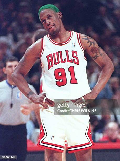 Chicago Bulls forward Dennis Rodman looks at the referee after being called for illegal defense against the New York Knicks 06 December during the...