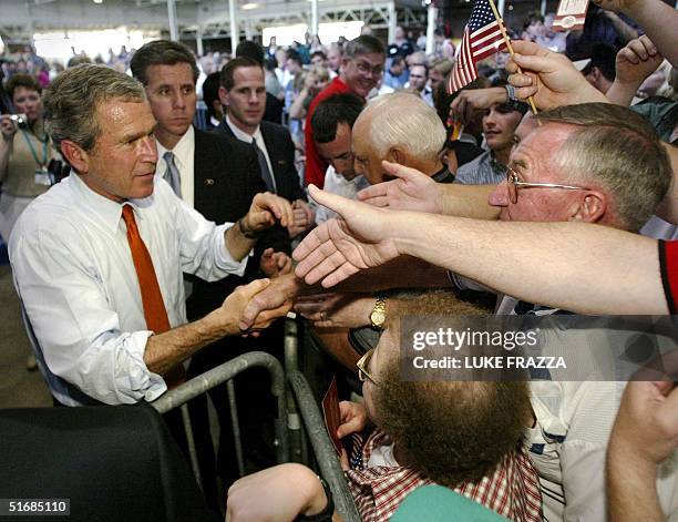 President George W. Bush greets supporters at the 14th annual World Pork Expo at the Iowa State Fairgrounds in Des Moines, Iowa 07 June 2002. Bush is...