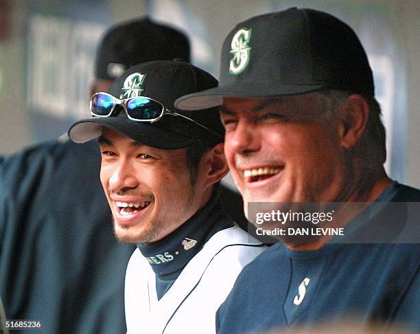 Seattle Mariners' manager Lou Piniella and player Ichiro Suzuki share a laugh prior to the start of their game against the Chicago Cubs in Seattle 08...