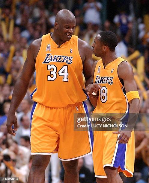 Shaquille O'Neal smiles at teammate Kobe Bryant of the Los Angeles Lakers during the 2nd half of Game 6 of the Western Conference Finals against the...