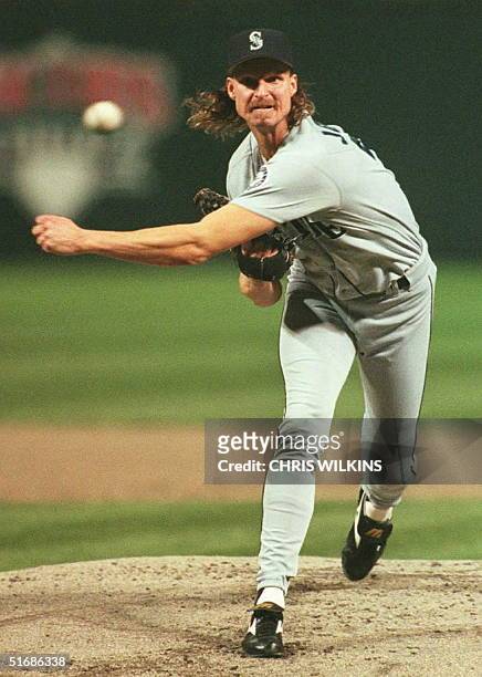 Seattle Mariners starting pitcher Randy Johnson throws to the plate against the Cleveland Indians in the first inning 13 October of game three of the...