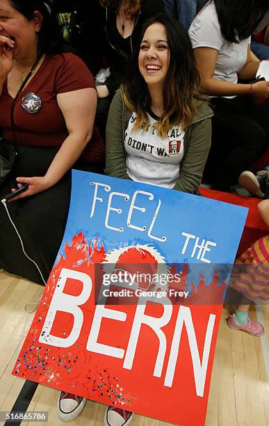 Bernadette High sits on bleachers with other Bernie Sanders supporters during a campaign rally for Democratic presidential candidate Bernie Sanders...