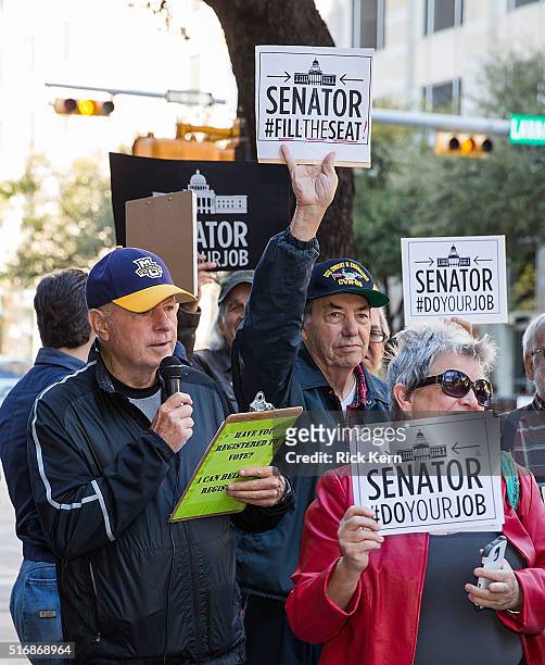 Central Texas council organizer for MoveOn.org, Bill Hamm speaks to protesters outside of Senator John Cornyn's office building during National Day...