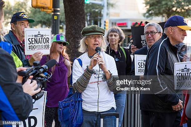 Glenn Scott speaks to protesters outside of Senator John Cornyn's office building during National Day Of Action calling on Senate Republicans to 'Do...