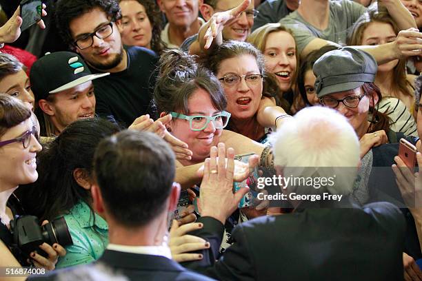 Democratic presidential candidate Bernie Sanders shakes hands after a speech at West High School at a campaign rally on March 21, 2016 in Salt Lake...