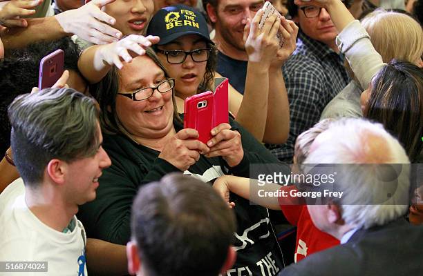 Democratic presidential candidate Bernie Sanders shakes hands after a speech at West High School at a campaign rally on March 21, 2016 in Salt Lake...