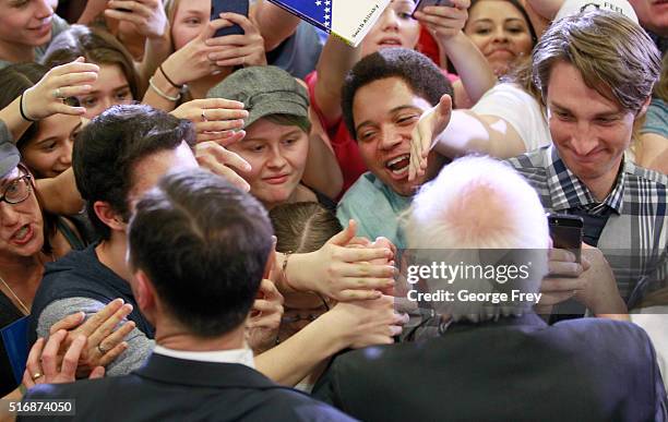 Democratic presidential candidate Bernie Sanders shakes hands after a speech at West High School at a campaign rally on March 21, 2016 in Salt Lake...