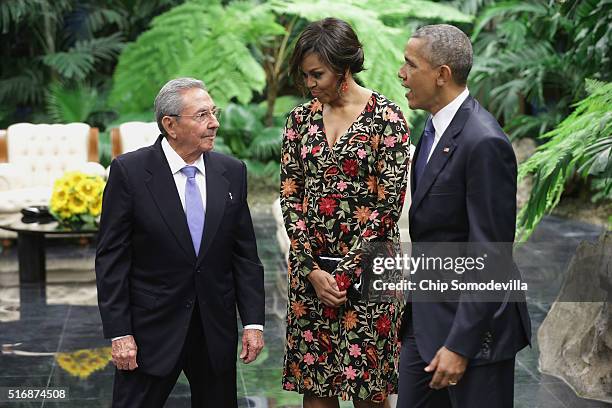 Cuban President Raul Castro greets U.S. First lady Michelle Obama and U.S. President Barack Obama before a state dinner at the Palace of the...