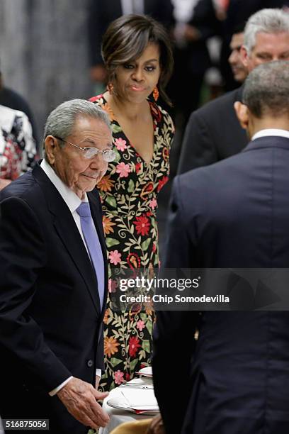 Cuban President Raul Castro , U.S. President Barack Obama and first lady Michelle Obama arrive for a state dinner at the Palace of the Revolution...