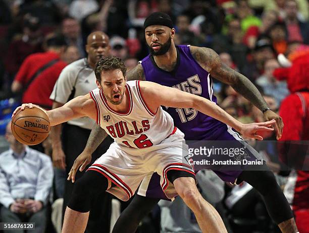 Pau Gasol of the Chicago Bulls moves against DeMarcus Cousins of the Sacramento Kings at the United Center on March 21, 2016 in Chicago, Illinois....