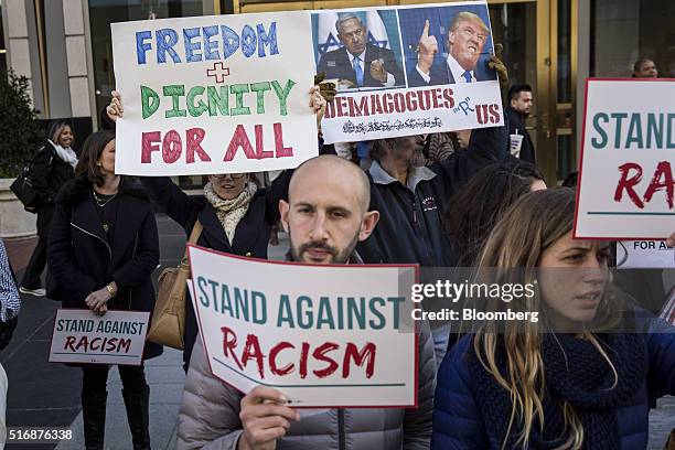 Protesters hold signs outside the American Israeli Public Affairs Committee policy conference in Washington, D.C., U.S., on Monday, March 21, 2016....