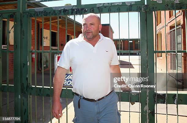 Peter Moody closes the gates to his stables after a press conference on March 22, 2016 in Melbourne, Australia.