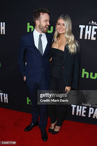 Actor Aaron Paul and Lauren Parsekian arrive during the premiere of Hulu's "The Path" at ArcLight Hollywood on March 21, 2016 in Hollywood,...