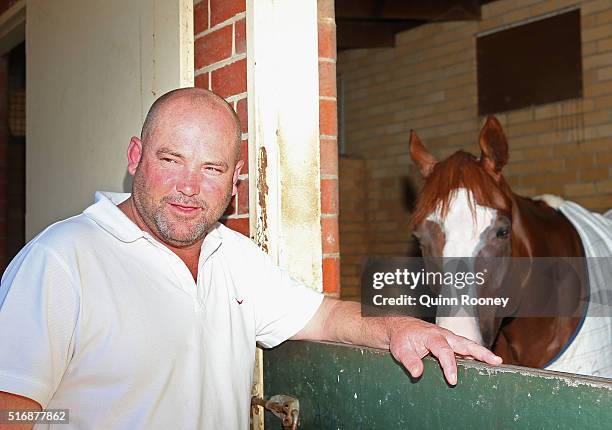 Peter Moody poses in his stable during a press conference on March 22, 2016 in Melbourne, Australia.