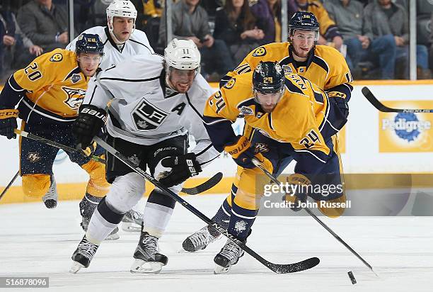 Eric Nystrom of the Nashville Predators skates against Anze Kopitar of the Los Angeles Kings during an NHL game at Bridgestone Arena on March 21,...