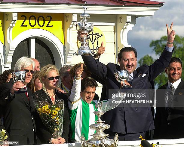 Trainer Bob Baffert , Jill Moss , jockey Victor Espinosa and owner Saudi Prince Ahmed bin Salman celebrate after War Emblem won the 127th running of...