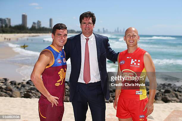 Brisbane Lions captain Tom Rockliff, AFL CEO Gillon McLachlan and Gold Coast Suns captain Gary Ablett pose during a press conference at Oskars on...