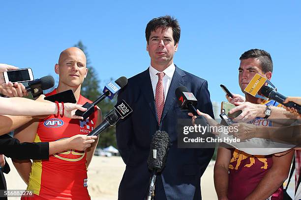 Gold Coast Suns captain Gary Ablett, AFL CEO Gillon McLachlan and Brisbane Lions captain Tom Rockliff speak to media during a press conference at...