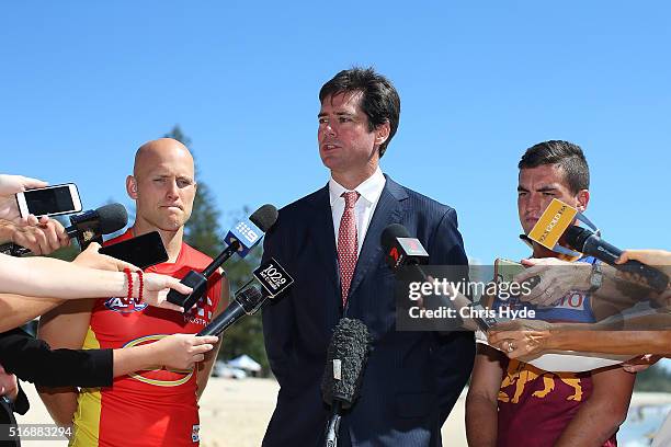 Gold Coast Suns captain Gary Ablett, AFL CEO Gillon McLachlan and Brisbane Lions captain Tom Rockliff speak to media during a press conference at...