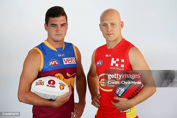 Brisbane Lions captain Tom Rockliff and Gold Coast Suns captain Gary Ablett pose during a press conference at Oskars on Burleigh on March 22, 2016 in...