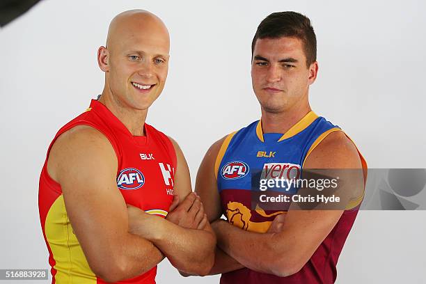 Brisbane Lions captain Tom Rockliff and Gold Coast Suns captain Gary Ablett pose during a press conference at Oskars on Burleigh on March 22, 2016 in...