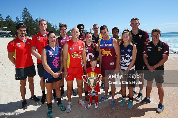 Gold Coast Suns captain Gary Ablett and Brisbane Lions captain Tom Rockliff celebrate Queensland's 150 year anniversary of Australian Rules Football...