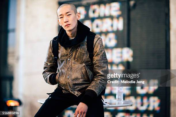 Korean model Wonjung Jo a vintage motorcycle leather jacket after the Rick Owens show at Palais de Tokyo on Day 2 of Paris Fashion Week Mens on...
