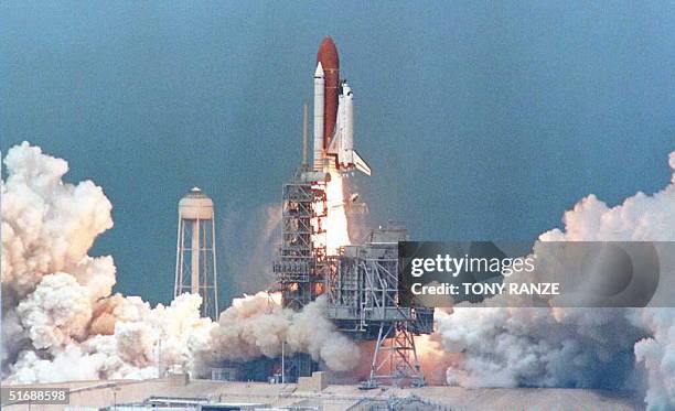 The Space Shuttle Atlantis climbs into the sky 27 June on its way to orbit from launch pad 39-A at Kennedy Space Center, FL. The Shuttle and her...