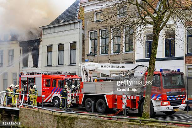 firefighting in the old city of kampen - fire truck stock pictures, royalty-free photos & images