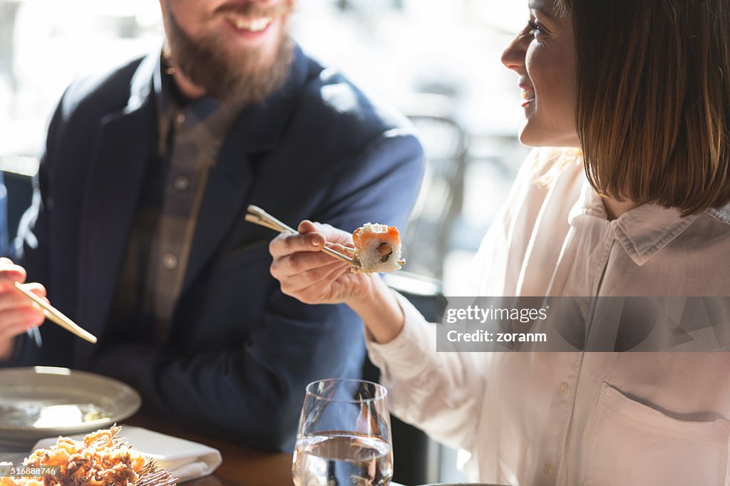 Friends eating sushi