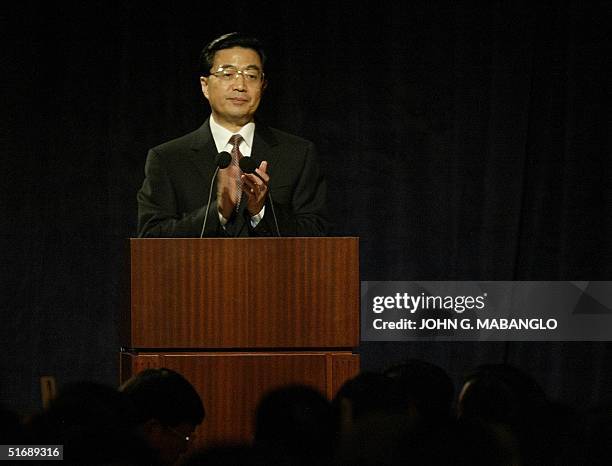 Vice President Hu Jintao of the People's Republic of China applauds as he speaks at a Welcome Luncheon hosted by the Overseas Chinese of the San...