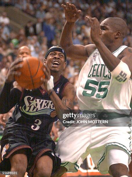 Allen Iverson of the Philadelphia 76ers drives against Eric Williams of the Boston Celtics in the fourth quarter of the fifth and final game of their...