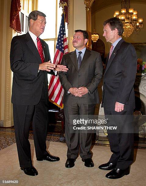 Senate Majority Leader Tom Daschle and Senate Minority Leader Trent Lott greet King Abdullah of Jordan 08 May 2002 during his visit to the US Capitol...