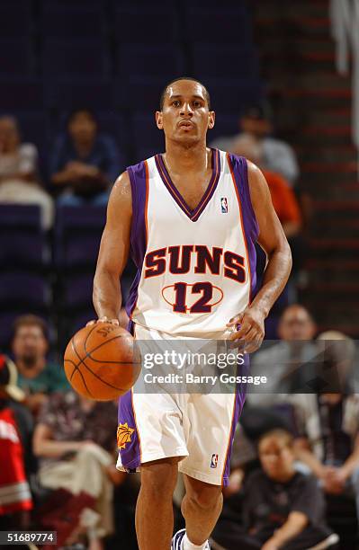 Howard Eisley of the Phoenix Suns dribbles upcourt against the Utah Jazz during a preseason game October 20, 2004 at America West Arena in Phoenix,...