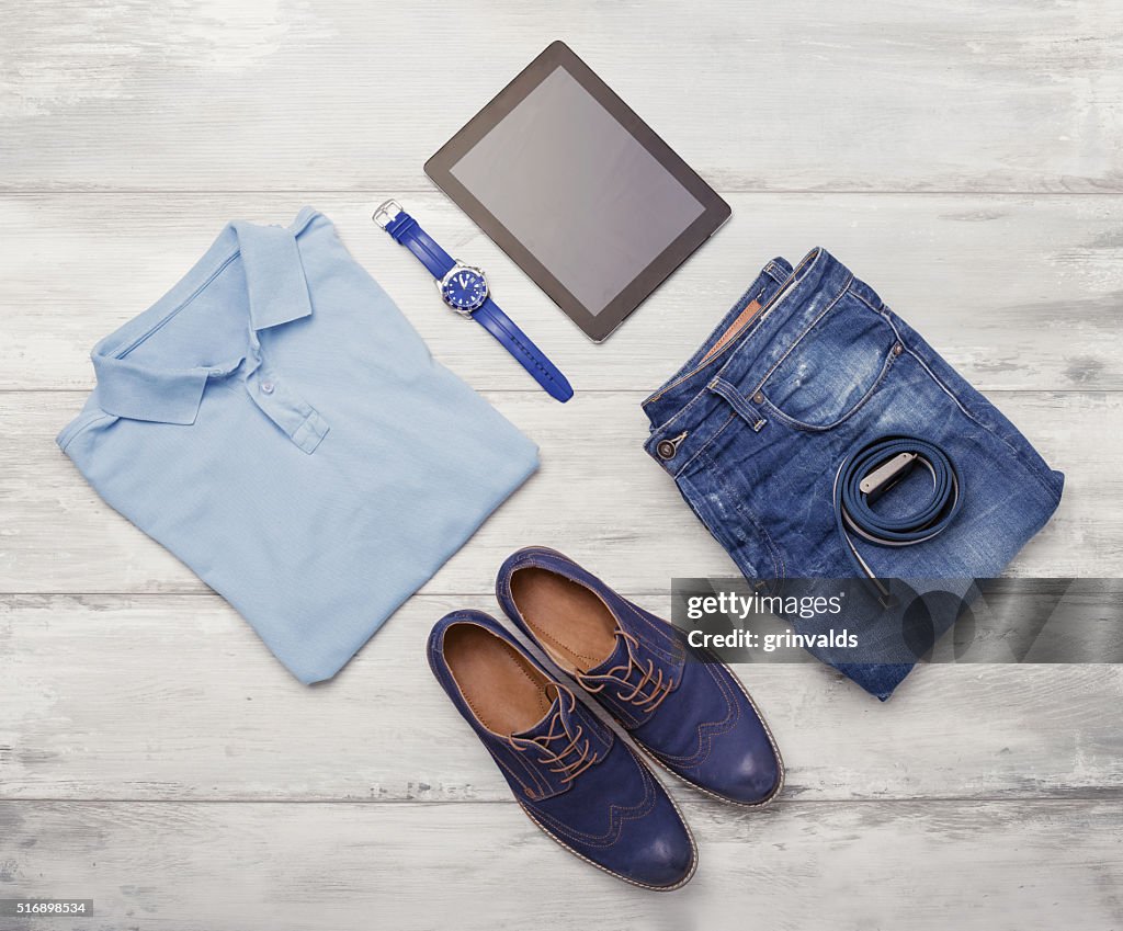 Man's clothing, watch and tablet