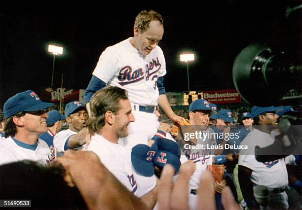 Pitcher Nolan Ryan of the Texas Rangers is carried off the field by his teammates, after Ryan's seventh no-hitter of his carrer against the Toronto...