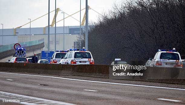 Police officers stand guard around the Zaventem Airport after two explosions went off in Brussels, Belgium on March 22, 2016.